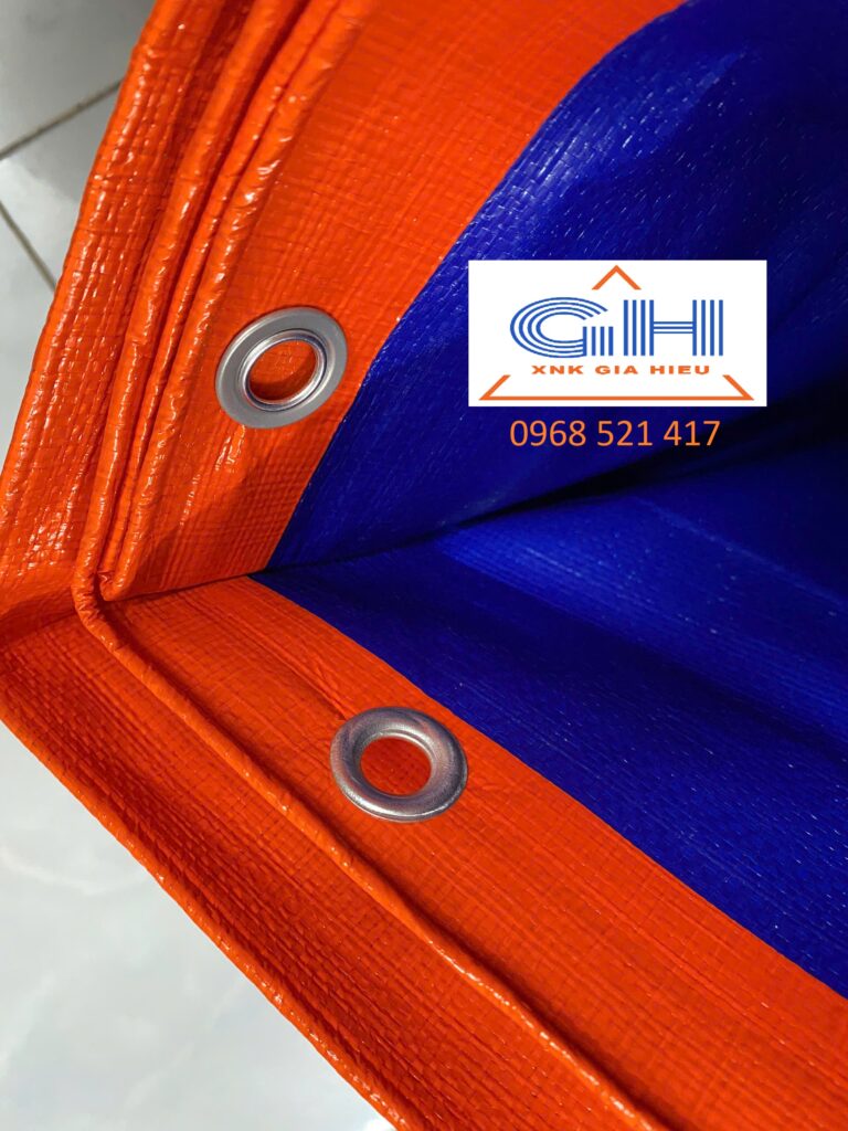 Bạt Che Tàu Thuyền & Phủ Hàng Hóa Khổ Lớn: Giải Pháp Kháng Mặn Vượt Trội Từ Bạt Nhựa Hàn Quốc 15 Bạt xanh cam gia công ép biên đóng khoen